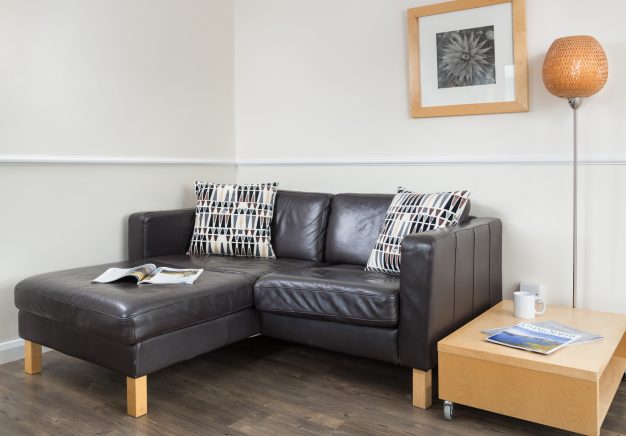 Comfy sofa for two in our Keswick self catering apartment.